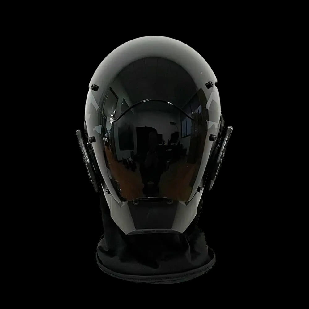Black helmet on a white mannequin head against a white background